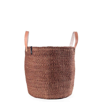 Brown woven basket with leather handles on a white background