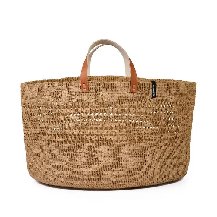 Woven basket with leather handles on a white background