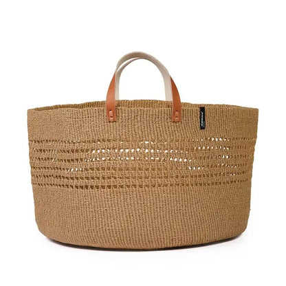 Woven basket with leather handles on a white background