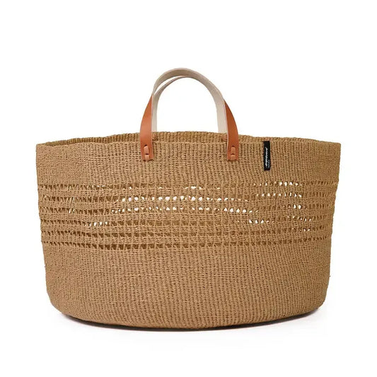 Woven basket with leather handles on a white background