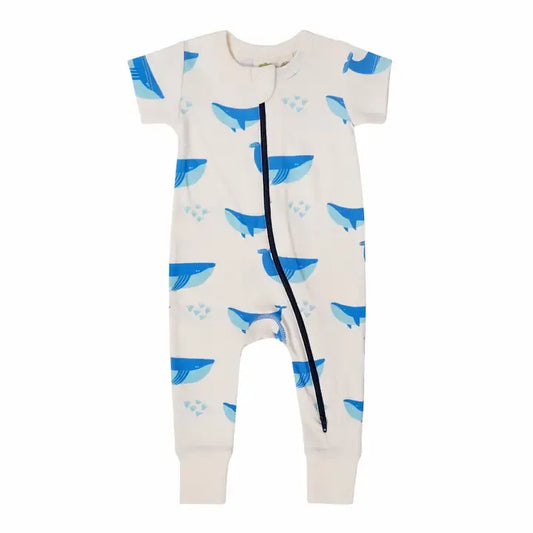 Baby onesie with blue whale pattern on a white background