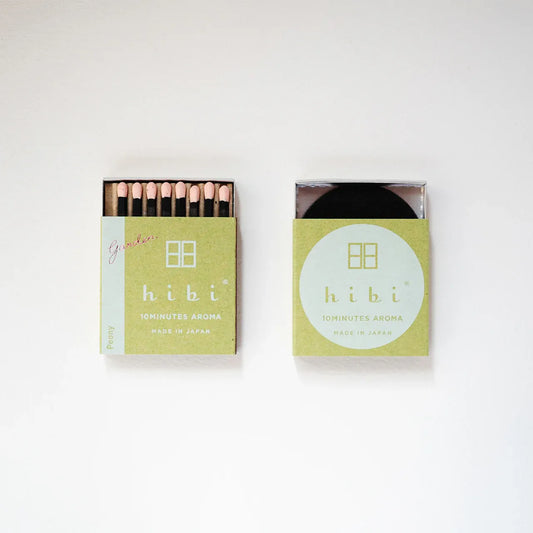 Two boxes of hibi matches on a white background