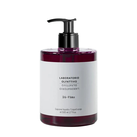 A bottle of Di-Vina liquid soap by Laboratorio Olfattivo Giamberto Azzaro, featuring a white label and a black pump dispenser, filled with a deep purple-red liquid, set against a clean white background.