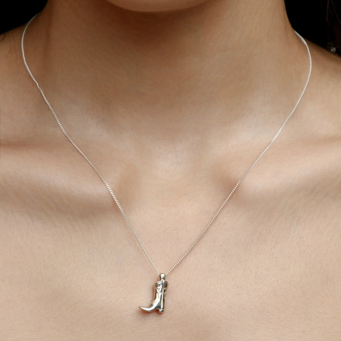 Wolf Circus Cowboy Boot Necklace, Sterling Silver on model