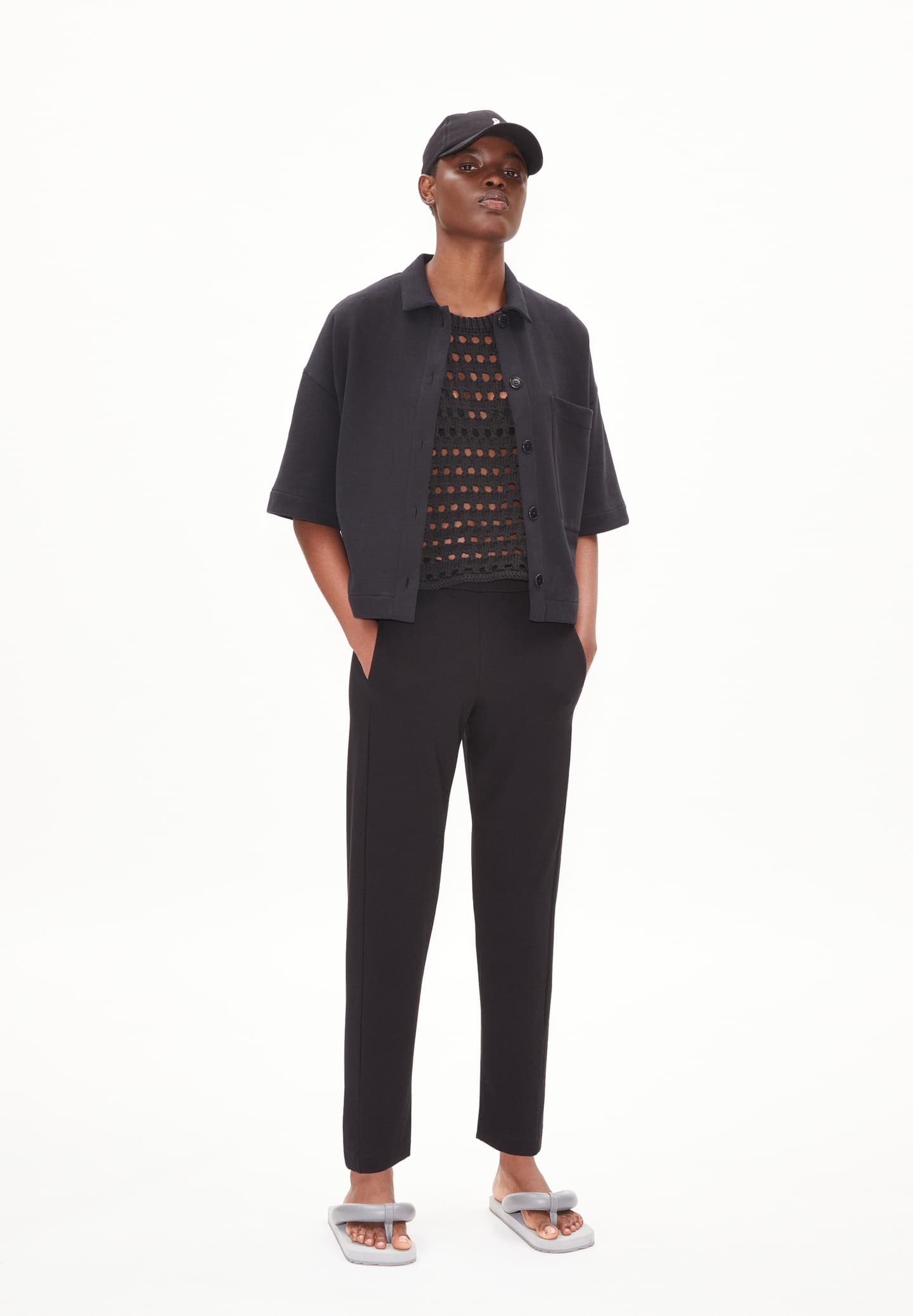 ARMEDANGELS Canada black tailored pants worn with short sleeve jacket and mesh top in Kelowna