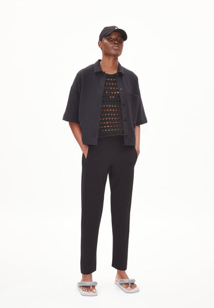ARMEDANGELS Canada black tailored pants worn with short sleeve jacket and mesh top in Kelowna