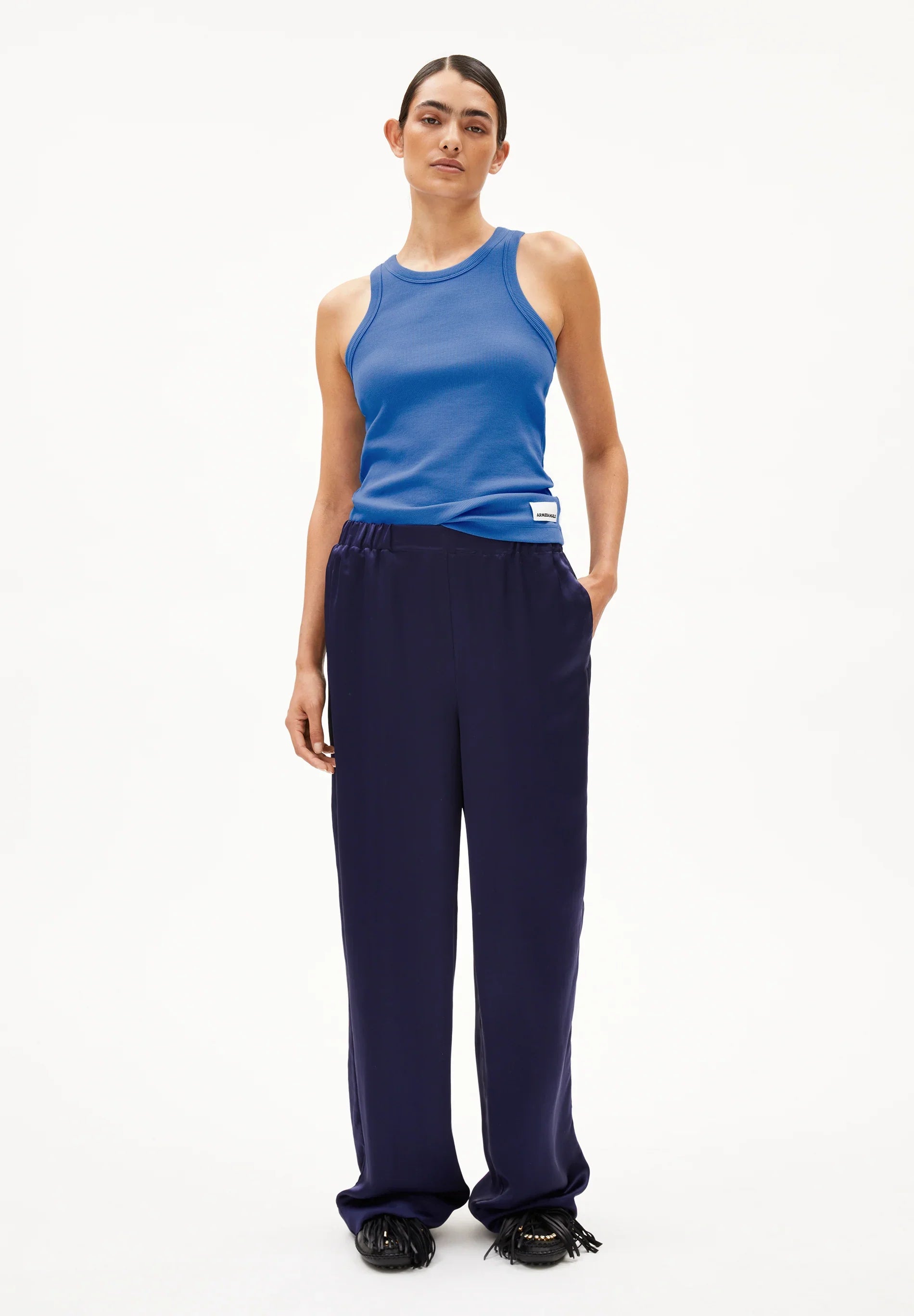 ARMEDANGELS Canada blue ribbed tank top paired with navy trousers for a stylish look in Kelowna and Canada
