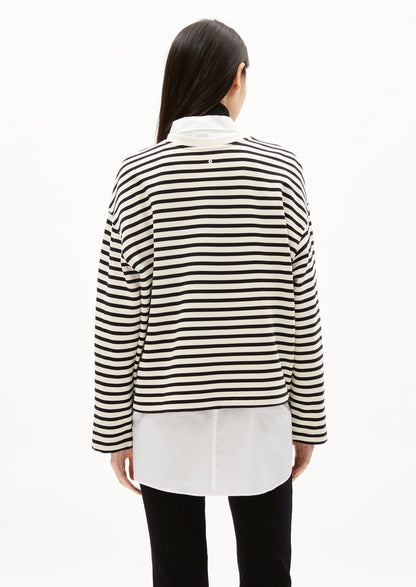 ARMEDANGELS Canada black and white striped long sleeve shirt layered over white button-up top in Kelowna