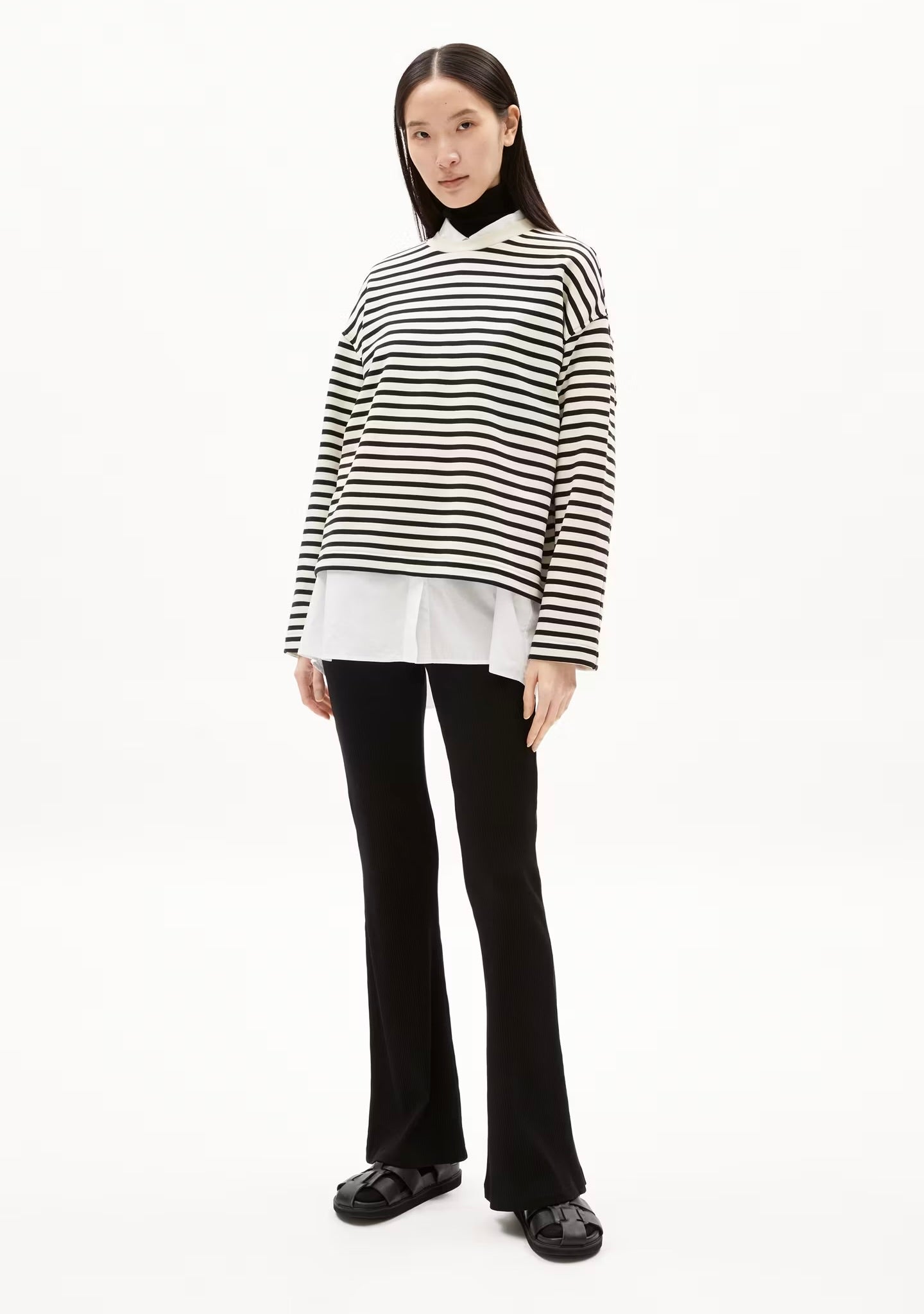 ARMEDANGELS Canada striped black and white long sleeve sweatshirt layered over white shirt worn by model in Kelowna