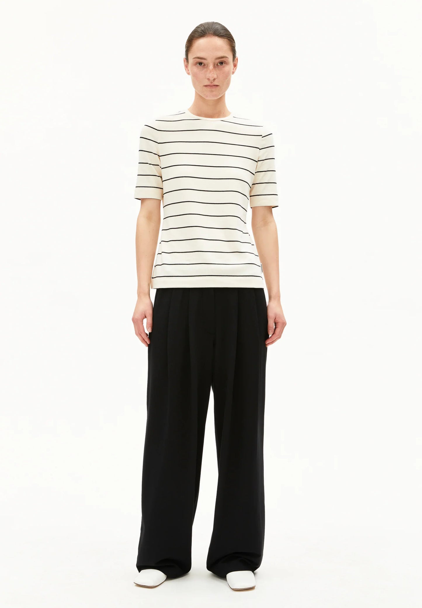 ARMEDANGELS Canada striped t-shirt in cream and black stripes designed for casual, stylish wear on model in Canada