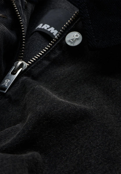 Close-up of a zip with an ARMEDANGELS logo pull on the Denim Jacket Cord Collar.