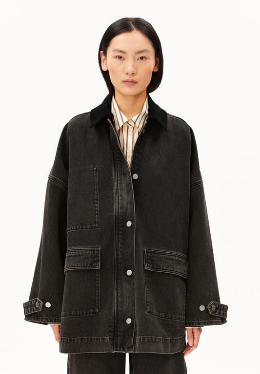 oman wearing ARMEDANGELS Canada Denim Jacket Cord Collar in a washed black denim with a black corduroy collar, front view against a white background.