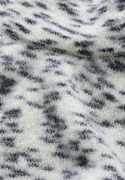 Close-up of the fluffy, speckled oatmilk and black flamé knit of ARMEDANGELS Canada Dotted Mohair-Blend Knit Vest.