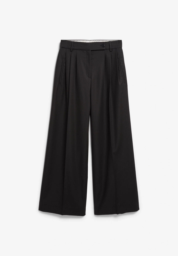 Front flatlay of ARMEDANGELS Canada Kaayua Wide Leg Pants in black on a light grey background, showing the front pleats and wide legs.