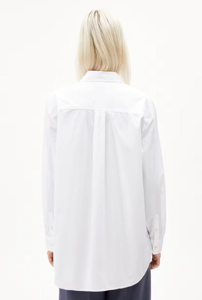 Back view of a woman wearing the ARMEDANGELS Canada Maalgaa Blouse in white, showing the back yoke and centre pleat, on a white background.