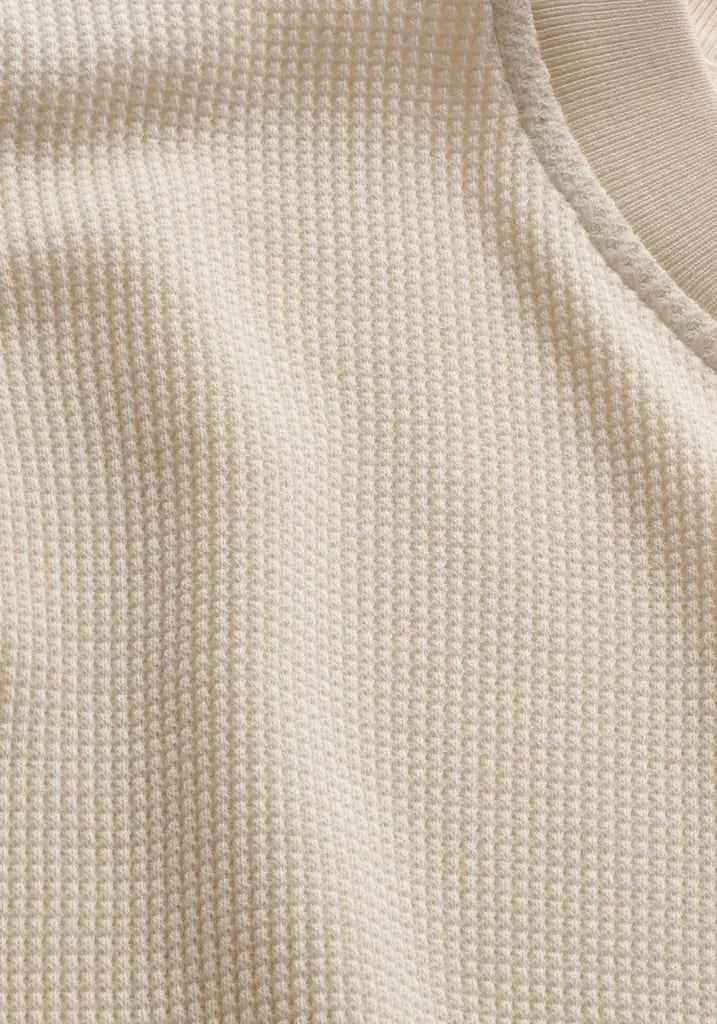 Close-up of beige fabric texture