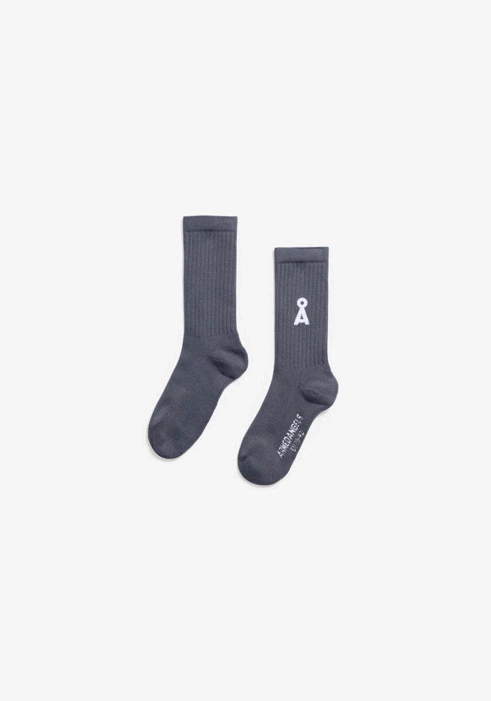 Two light navy socks with a logo on a light gray background