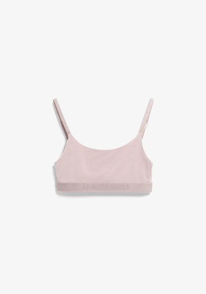 A light pink seamless bralette with thin adjustable shoulder straps and a wide, comfortable underband, shown flat against a clean white background.