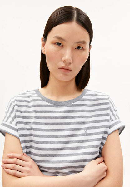 Woman wearing a striped t-shirt against a white background