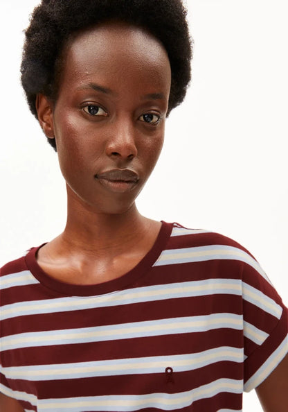 A close-up shot of a model wearing a short-sleeve crewneck t-shirt with horizontal burgundy and white stripes, set against a plain white background.