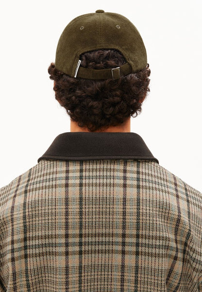 Back view of a man wearing ARMEDANGELS Canada Yenaas Cord Cap in Dark Earth, showing the back closure, against a white background.