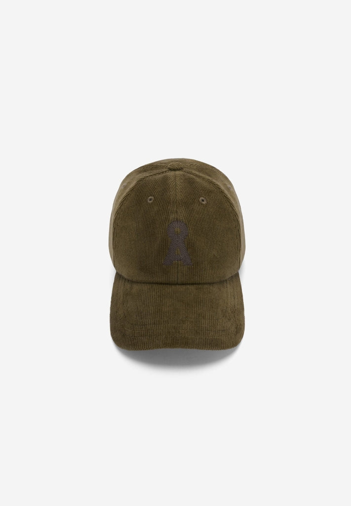 Front flatlay view of ARMEDANGELS Canada Yenaas Cord Cap in Dark Earth corduroy with a tonal embroidered logo, on a light grey background.