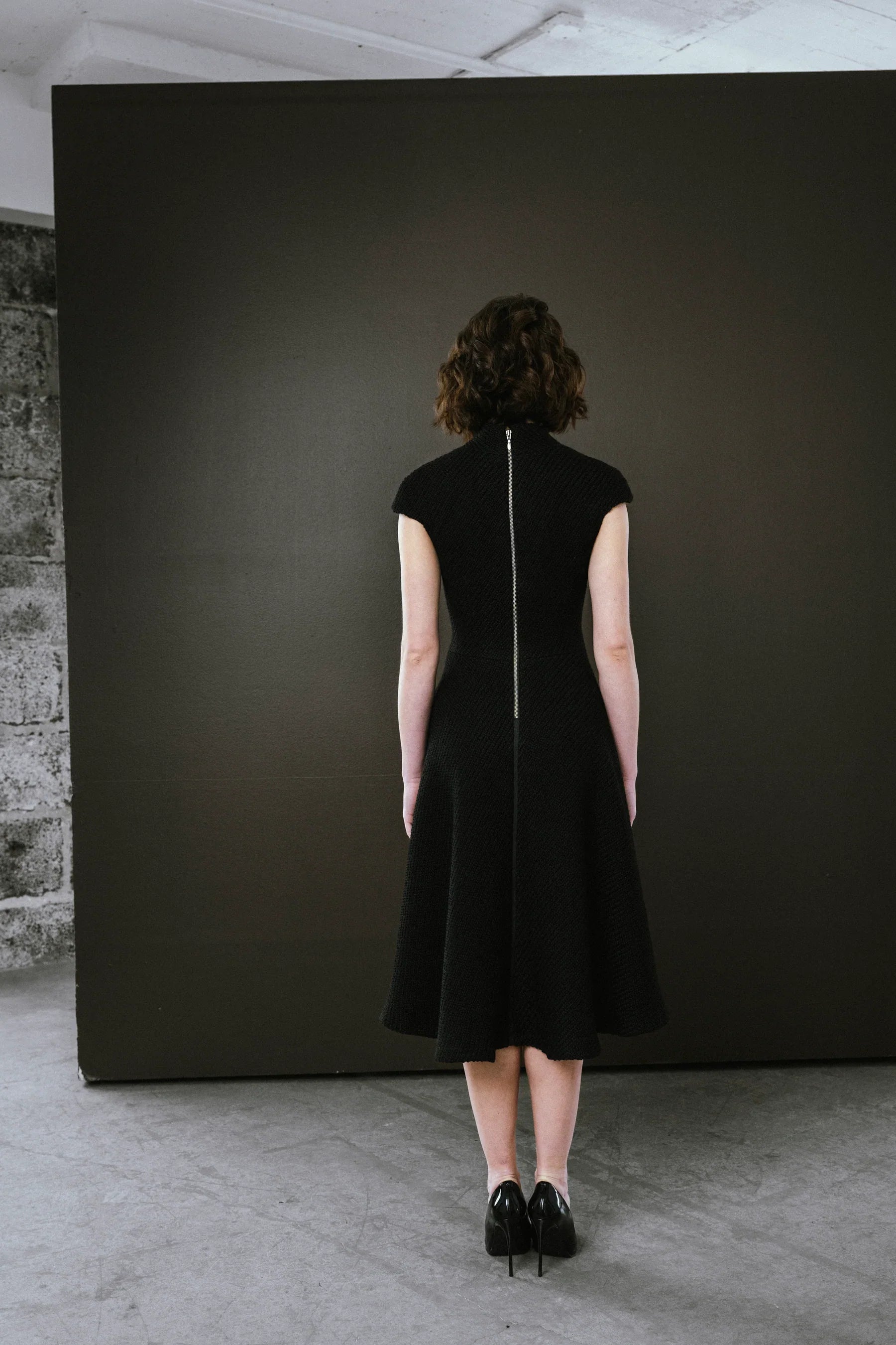 Elegant black dress by BodyBag by Jude with a fitted silhouette and zip closure at the back in Kelowna