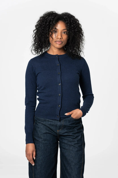 Women's navy merino wool cardigan featuring a button-up design and fitted silhouette in Kelowna