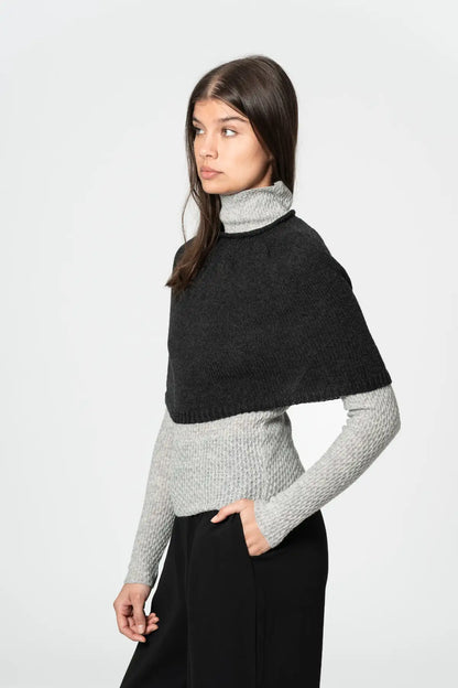 Dinadi two-tone poncho with a turtleneck design worn over a long-sleeve grey sweater in Kelowna and Canada