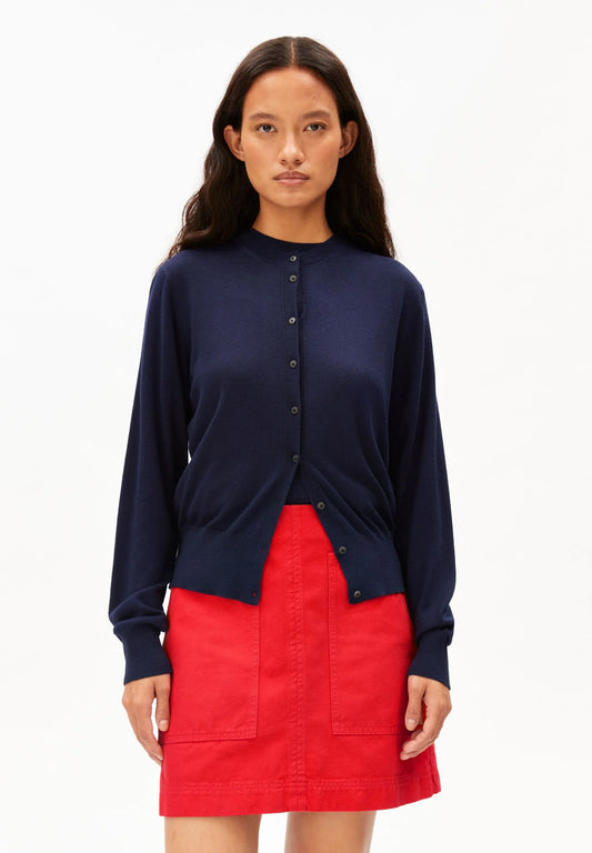 ARMEDANGELS Canada - FINE Knit Cardigan in Tinted Navy front view on model showing it styled. model in red shorts