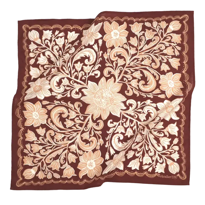 A square silk scarf featuring an ornate floral and scroll pattern in cream and beige on a deep burgundy background, with a small 'Hudson City' brand signature in the bottom right corner.