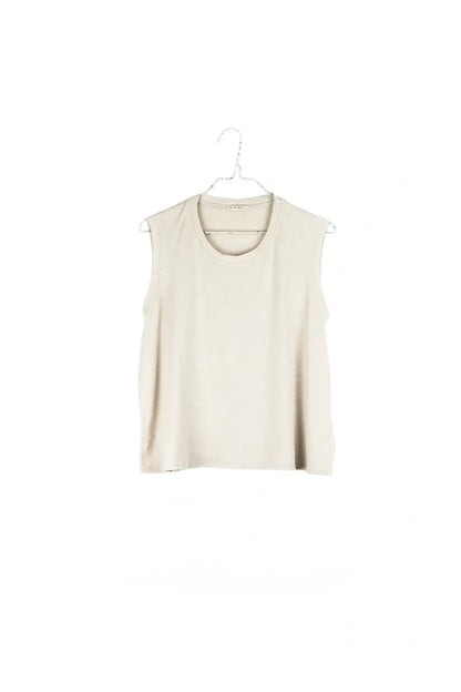 A sleeveless, scoop-neck knit top in a light cream or off-white color, hanging on a white plastic hanger against a solid white background.