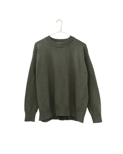 An olive green knit crewneck sweater hanging on a hanger against a plain white background.