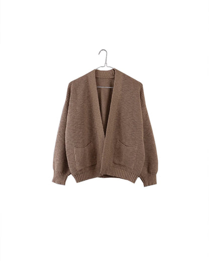 A brown ribbed knit cardigan sweater with front patch pockets, hanging on a metal hanger against a plain white background.