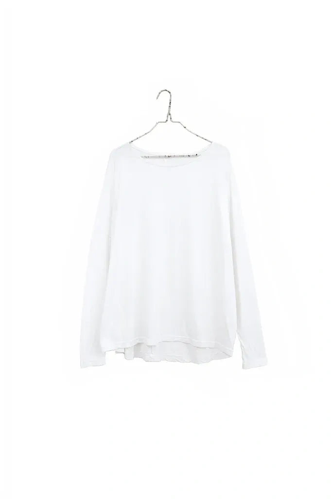 A white long-sleeve top with a wide, slightly draped neckline, hanging on a silver metal hanger against a solid white background.