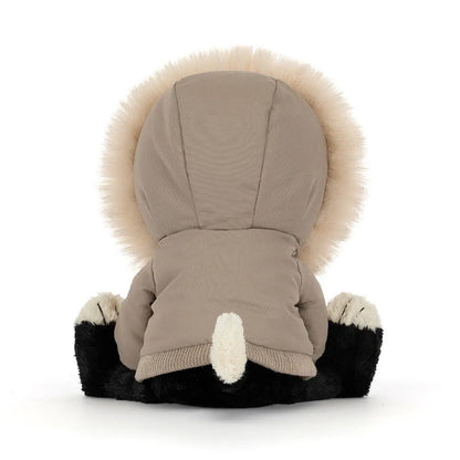 Back view of Jellycat Jack Alpine, showing the taupe parka hood and ribbed hem, the fluffy fur trim around the hood and a cream-tipped tail poking out.