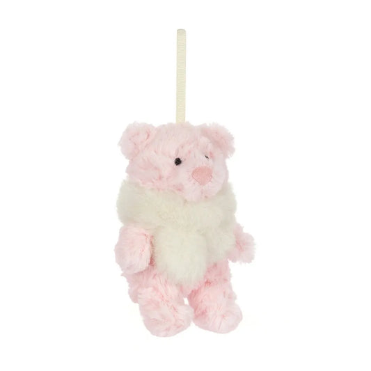 Jellycat Leola Bear Winter Warmer Decoration at an angle: a small fluffy pink bear with an embroidered pink nose and a cream faux-fur scarf, hanging from a cream ribbon loop.