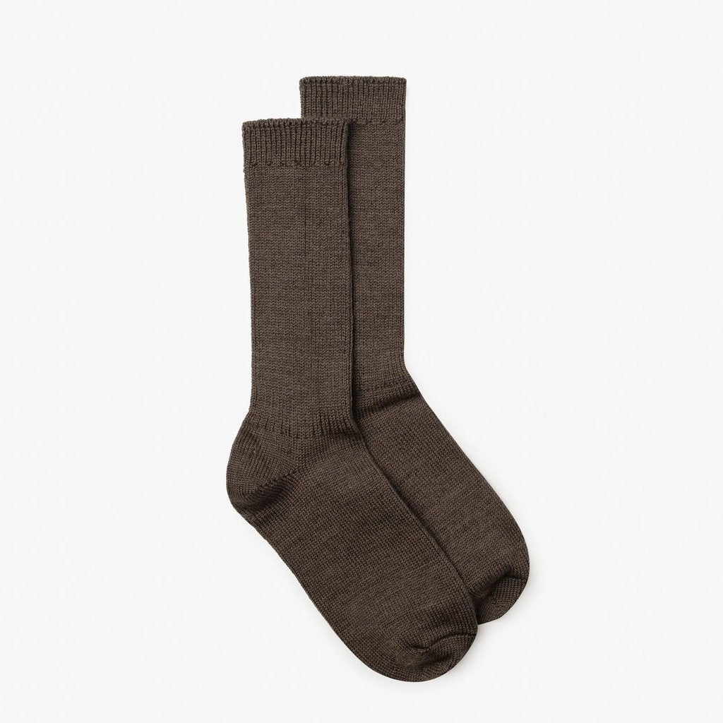 A pair of brown ribbed crew socks displayed against a clean, light off-white background.