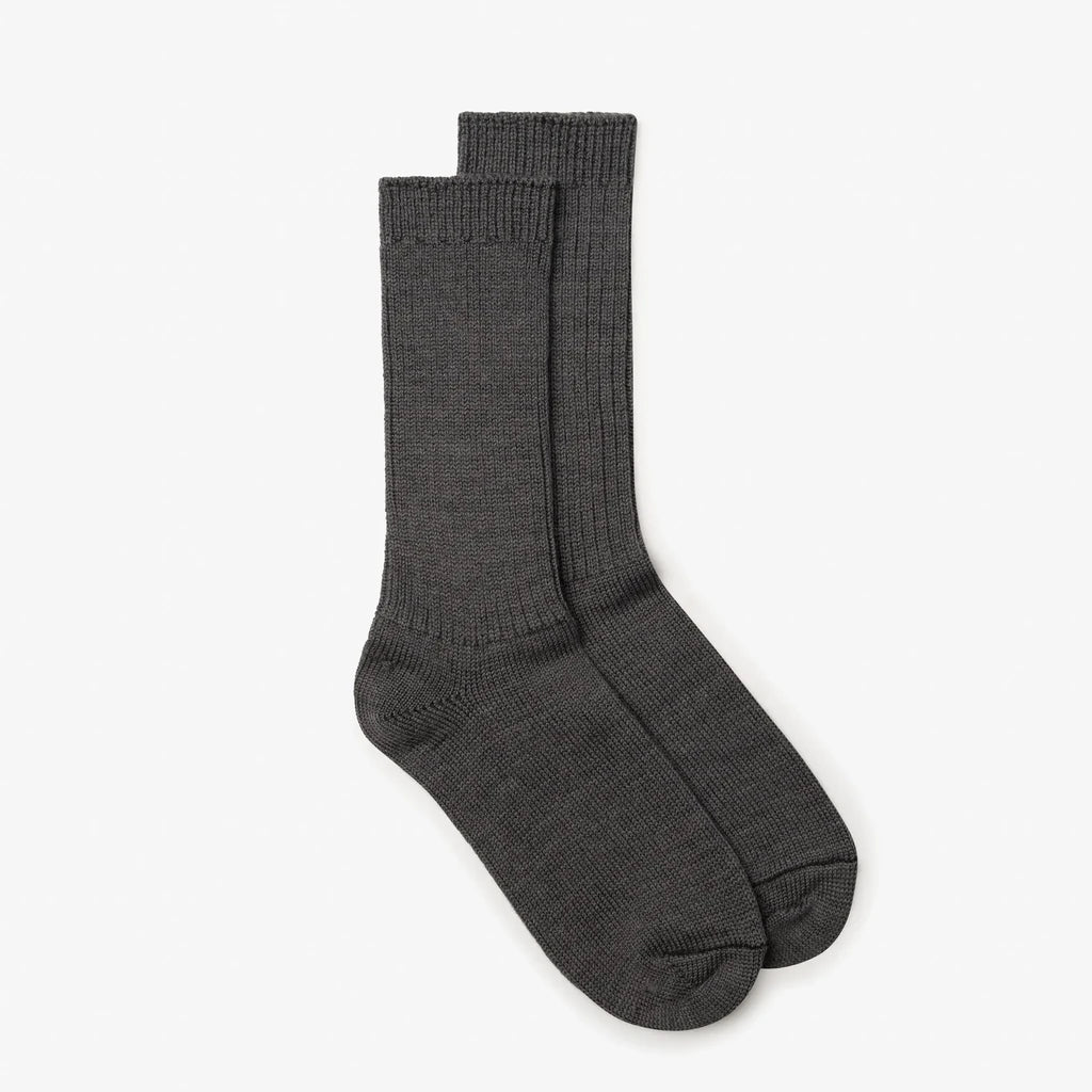 A pair of dark gray ribbed crew socks displayed against a clean, light gray background.