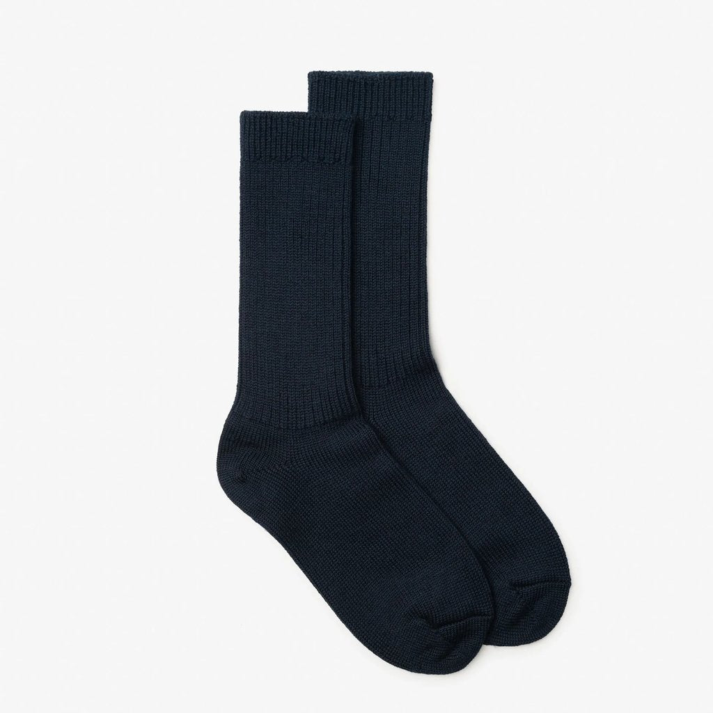 A pair of dark navy blue crew socks displayed flat against a clean, off-white background.