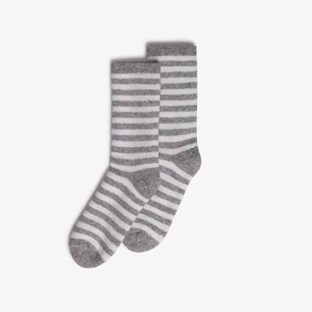 A pair of gray and white striped wool socks displayed against a clean, light gray background.