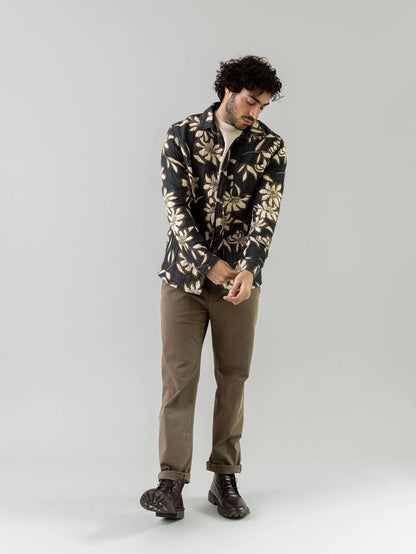 Man wearing the MOS MOSH Gallery Canada Jones All-Day Pant in Grape Leaf green, standing against a light grey studio background.
