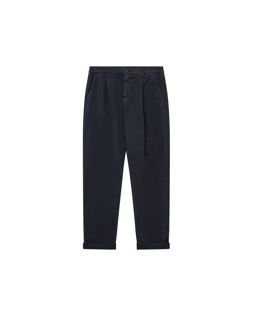 Flat lay of the MOS MOSH Gallery Canada Jones All-Day Pant in Salute Navy, front view, showing the pleats and turned-up hem on a white background.