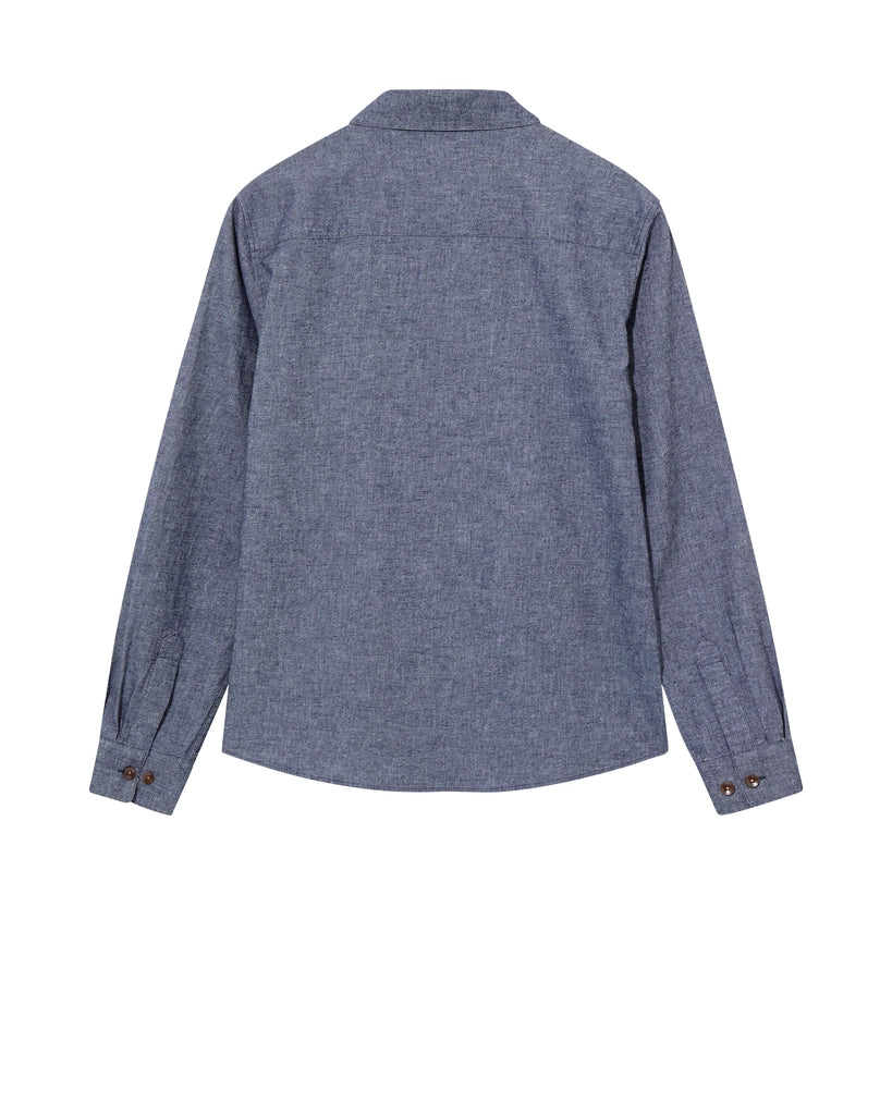 Flat lay of the MOS MOSH Gallery Canada Norbert Denim Shirt in vintage indigo, back view, showing the back yoke and button cuffs on a white background.