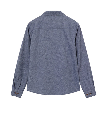 Flat lay of the MOS MOSH Gallery Canada Norbert Denim Shirt in vintage indigo, back view, showing the back yoke and button cuffs on a white background.