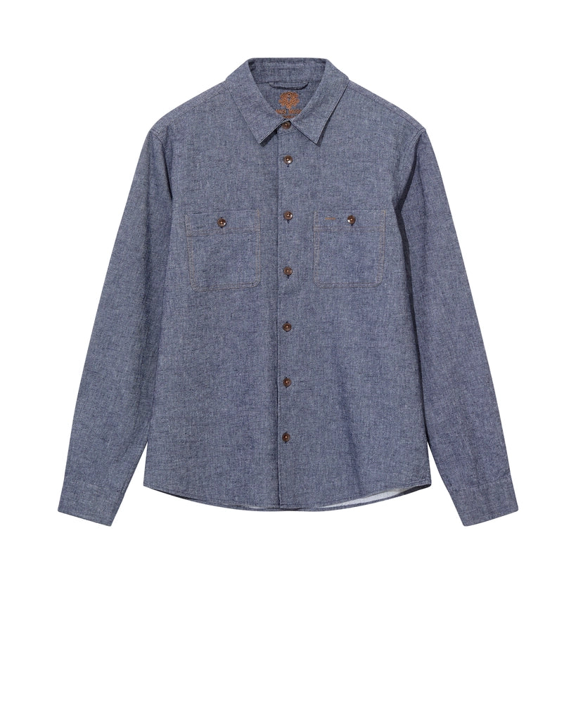Flat lay of the MOS MOSH Gallery Canada Norbert Denim Shirt in vintage indigo, front view, showing the two buttoned chest pockets and contrast stitching on a white background.