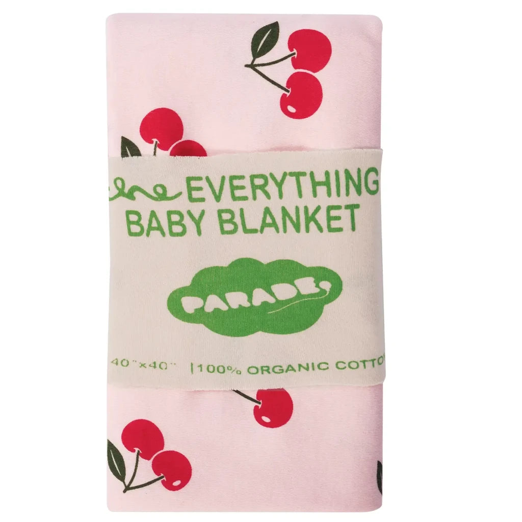Baby blanket with cherry design and 'Everything Baby Blanket Parade' text on a pink background