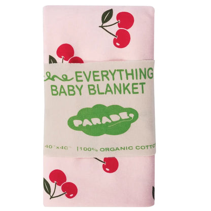 Baby blanket with cherry design and 'Everything Baby Blanket Parade' text on a pink background
