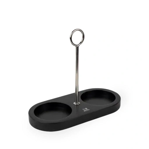 A black two-compartment tray with a central silver metal stand featuring a circular top, shown on a plain white background.