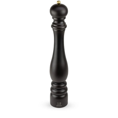 A tall black pepper mill with a small gold-toned metal knob on top, shown against a plain white background.